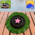 Solar-powered floating fountain pump with green leaf base and pink star nozzle on pond water