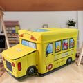 School Bus Toy Storage Box by Dollamis, partially open, showcasing its vibrant design.