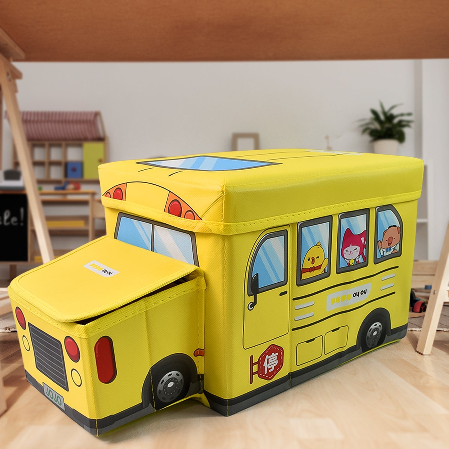 School Bus Toy Storage Box by Dollamis, partially open, showcasing its vibrant design.