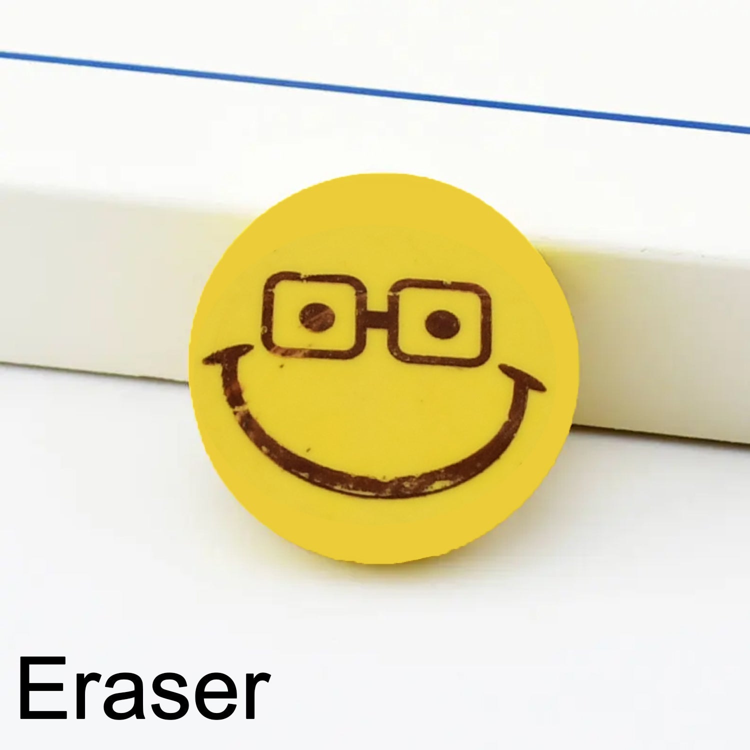 Bright yellow Smiley Eraser, perfect for kids' schoolwork.