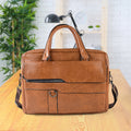 Tan brown faux leather laptop messenger bag with shoulder strap and handles