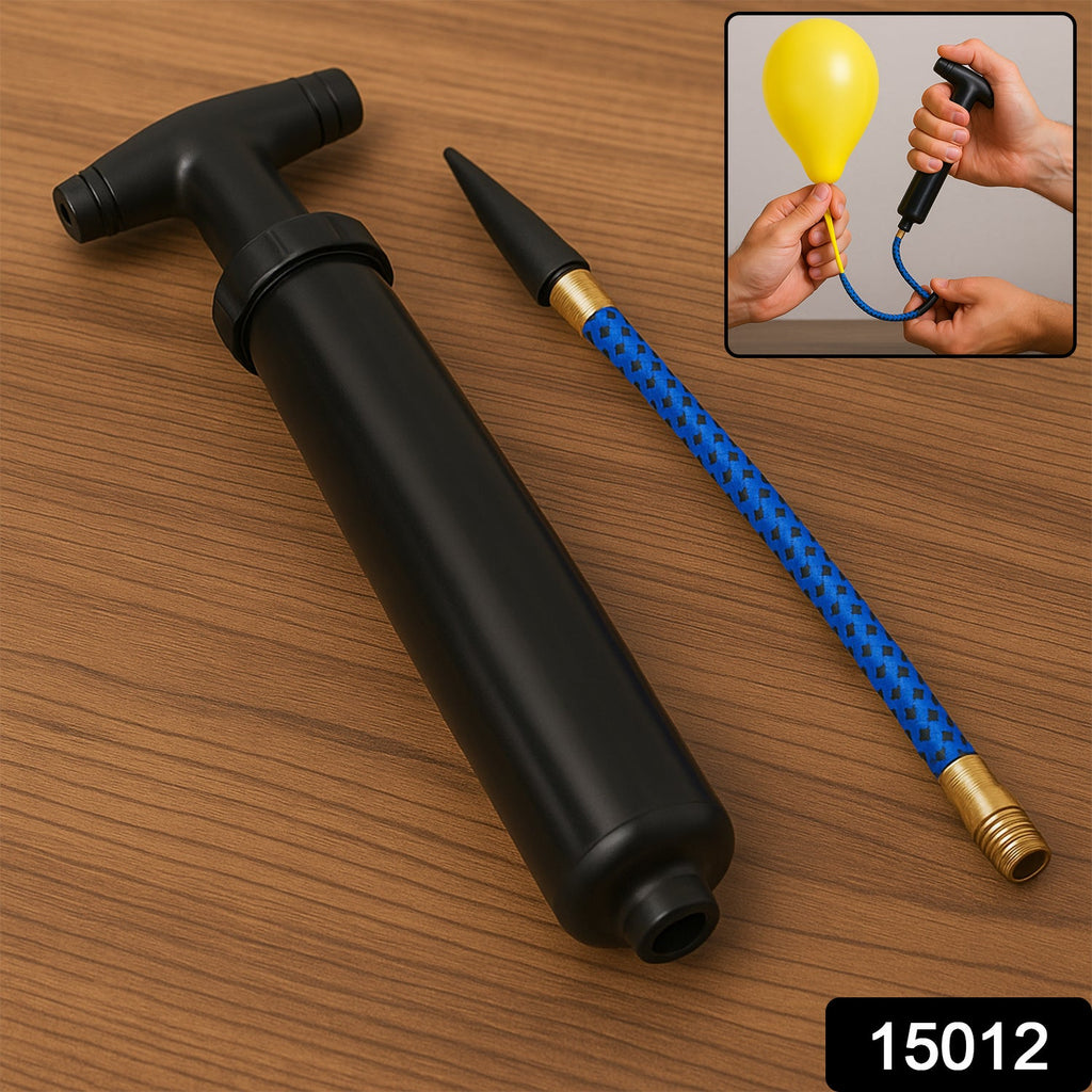 Hand holding the portable ball pump, showing its compact size.