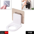 Multi-color adhesive bathroom hook mounted on a tiled wall, holding a bottle.