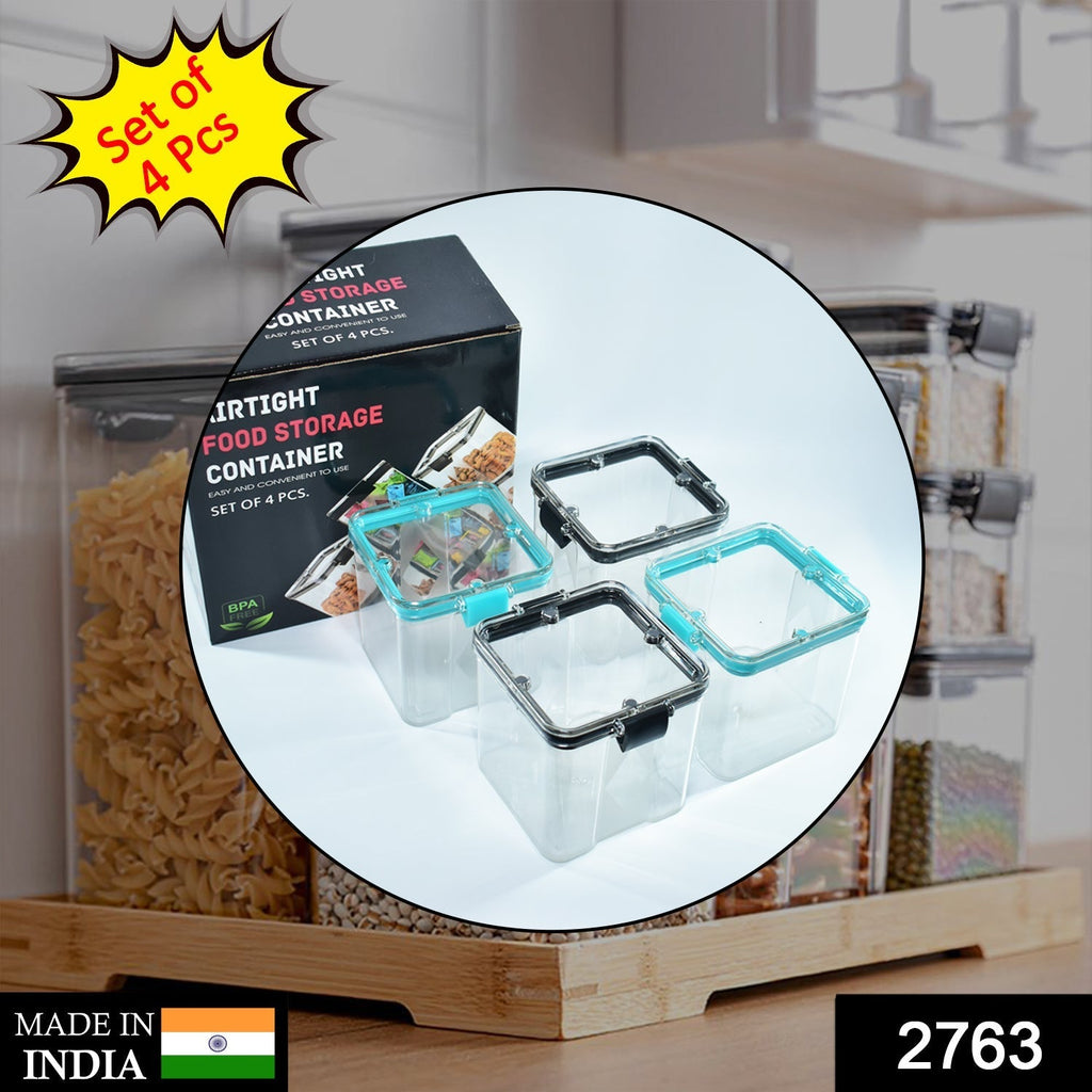 Transparent 700ml square containers with blue lids, neatly arranged for kitchen organisation.
