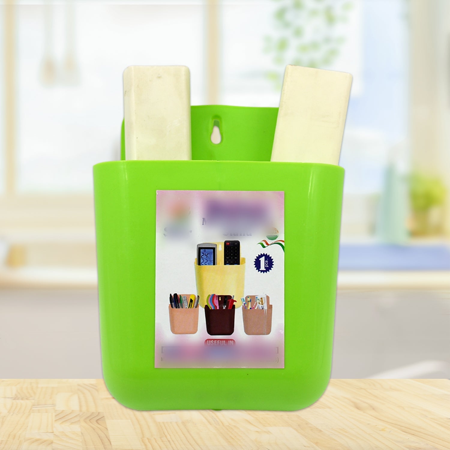 GlimmerHome 2-section wall holder neatly organizing a mobile phone and remote.