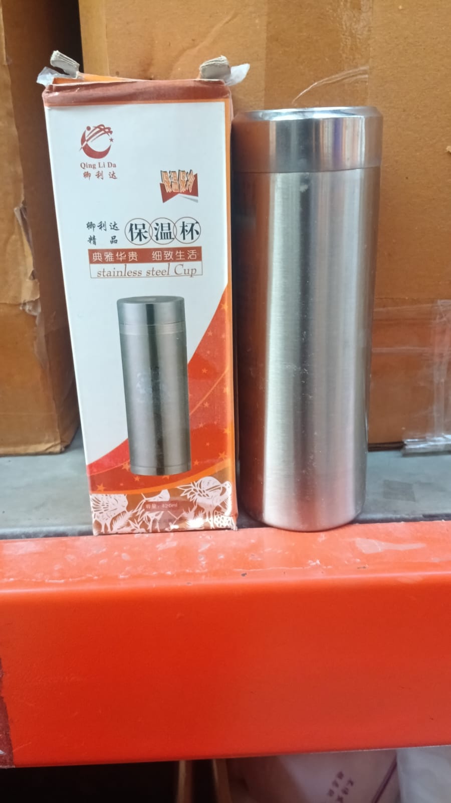 Lifestyle shot of the 380ml insulated bottle in a school backpack.