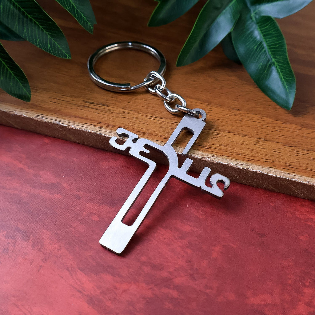 Metal cross keychain featuring Gujarati Jesus script on polished metal
