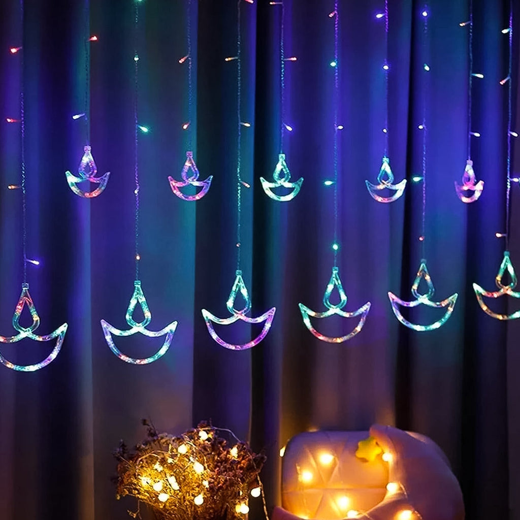 Vibrant multicolor Diya Curtain String Lights illuminating a festive window.