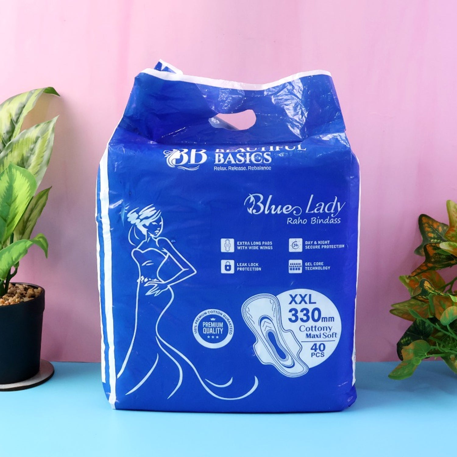A close-up of a  Sanitary Pads 330mm pack, highlighting the 'Blue Lady' branding and 'Extra Long' feature.