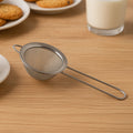 Stainless steel fine mesh strainer with slim ergonomic handle for kitchen use