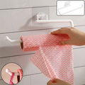 Wall mounted paper towel holder with strong suction cup holding kitchen tissue roll