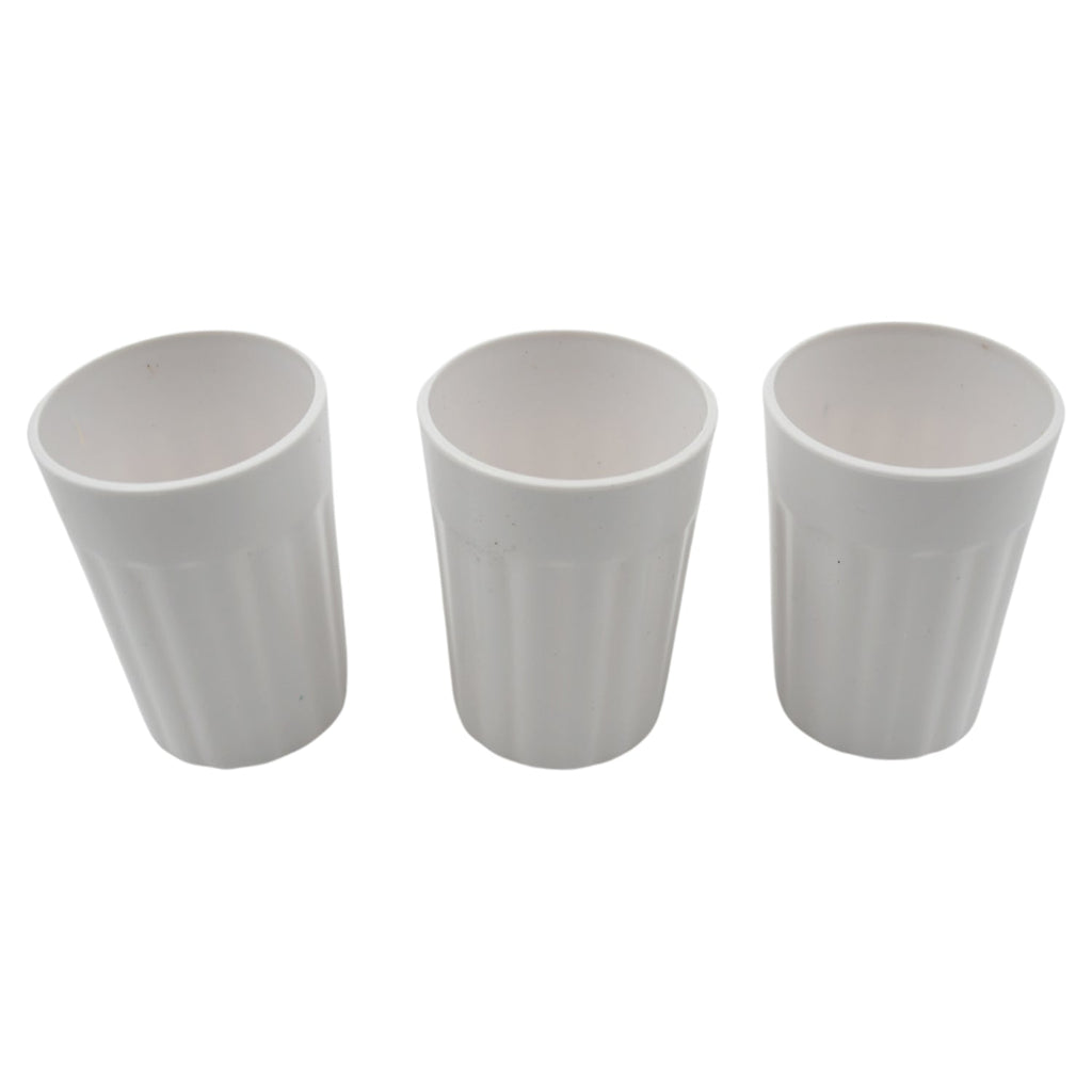 Multiple small plastic coffee and tea cups arranged for display.