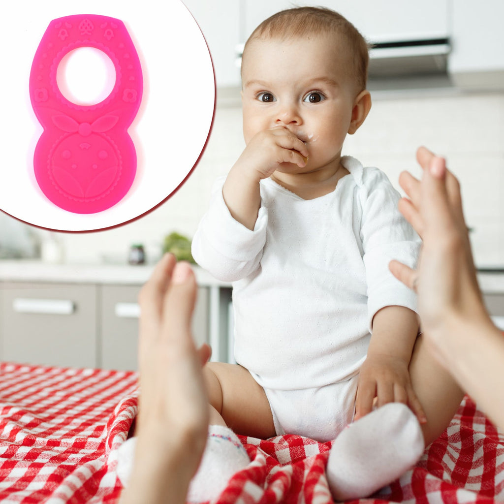 Close-up of a pink silicone teether, showcasing its flexible and safe material.