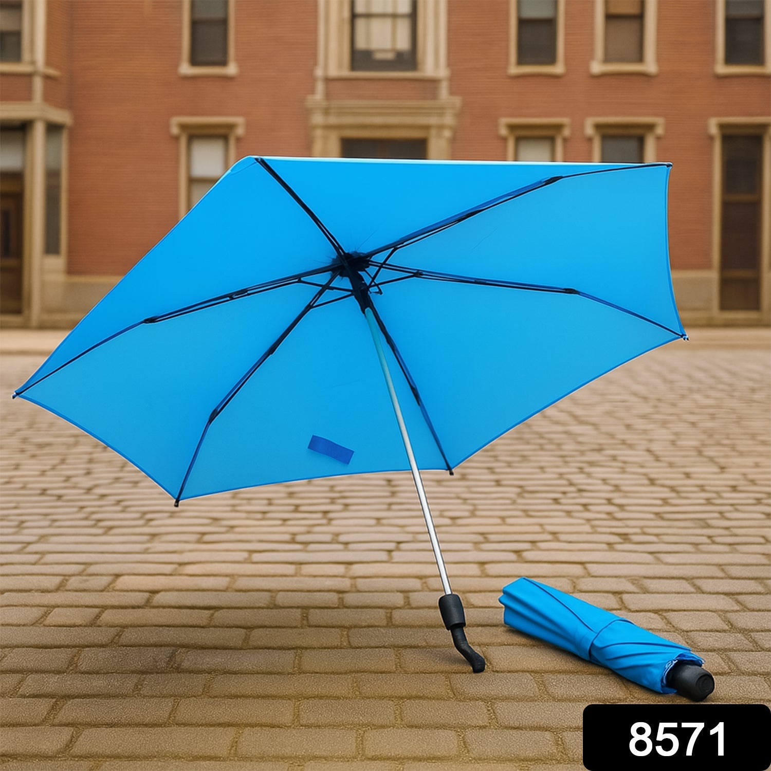 A DrizzlePro 3-fold umbrella partially open, showcasing its sturdy frame and colorful canopy.