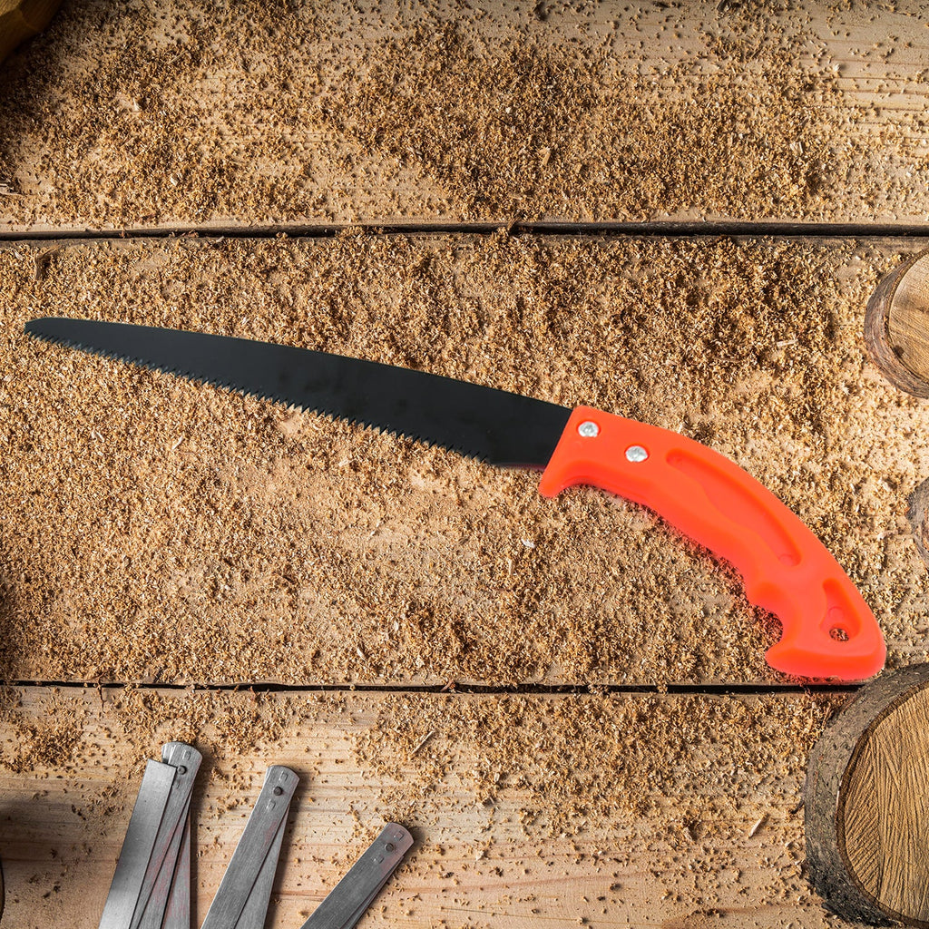 Gardener using the portable hand pruning saw to cut a tree branch cleanly.