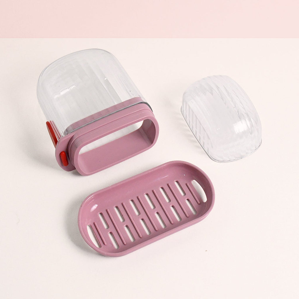 Oval-shaped plastic soap dish with detachable slotted drain tray for drying soap