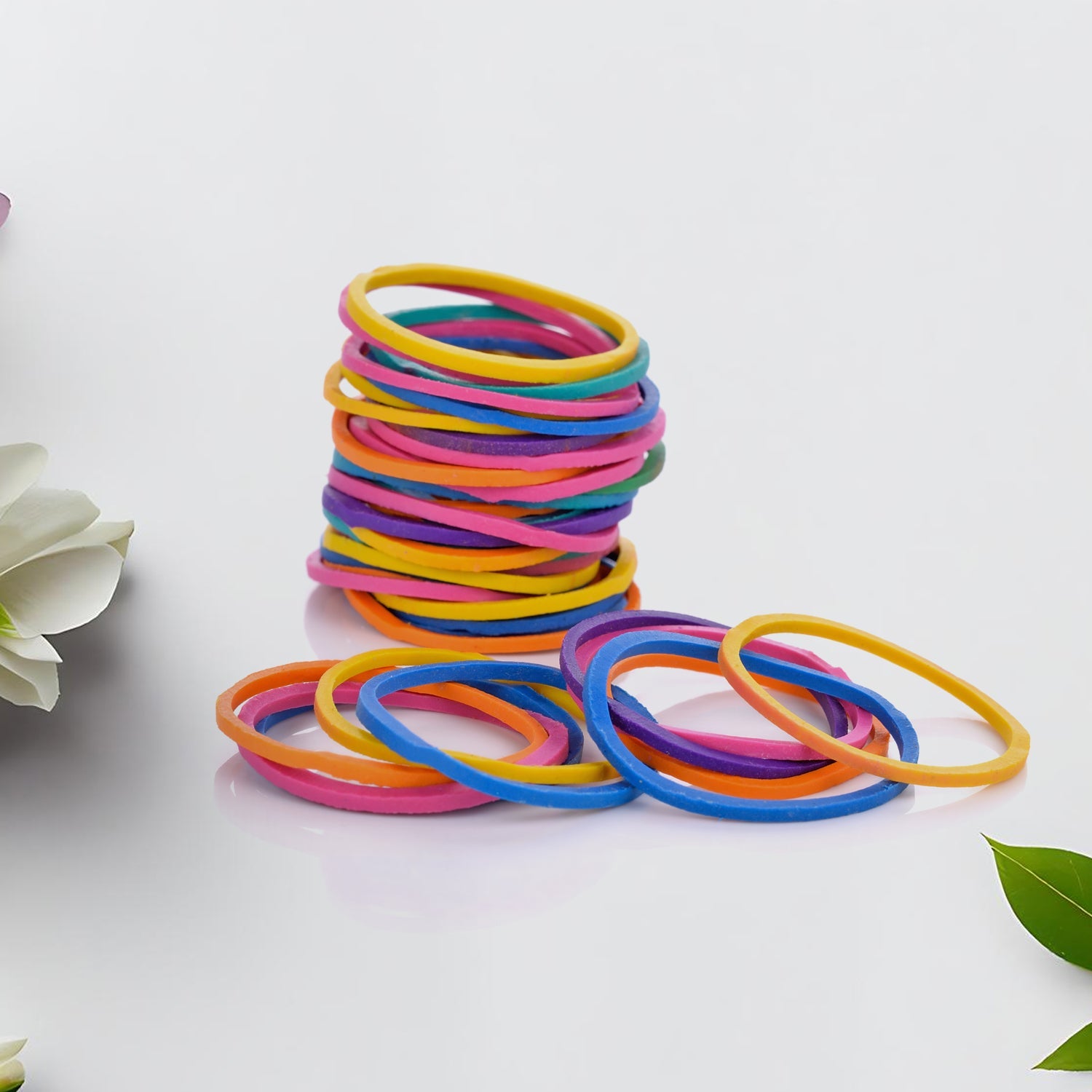Assorted multicolor elastic bands for office, kitchen, and school supplies.