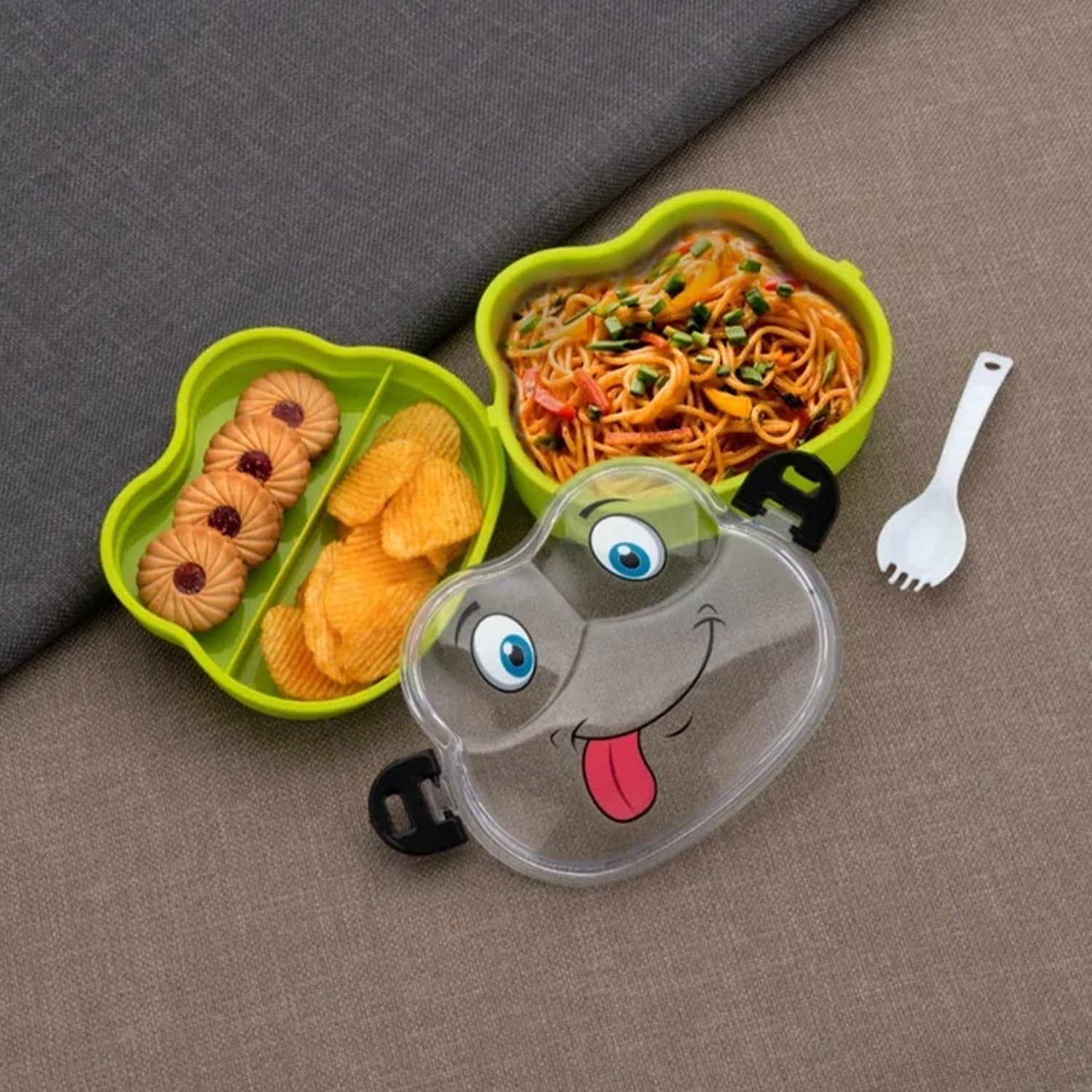 Green froggy lunch box with two compartments and a matching spoon.