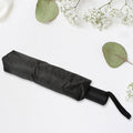 Compact umbrella easily sliding into a backpack pocket, highlighting its portability.
