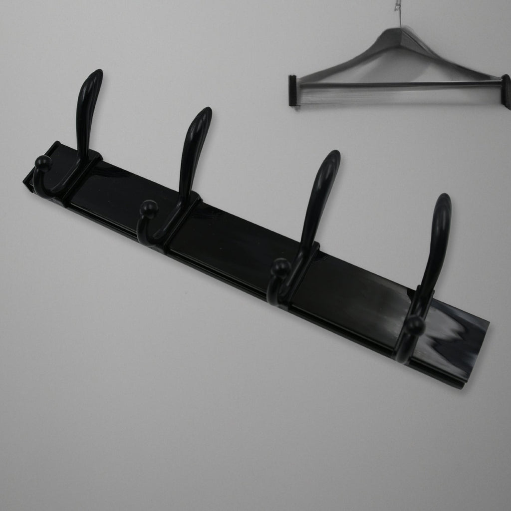 Top-down view of the 4-hook wall mount coat hanger holding various coats and hats.