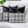 Close-up of a pair of Styleva Leather & Cotton Pillow Covers with elegant texture.