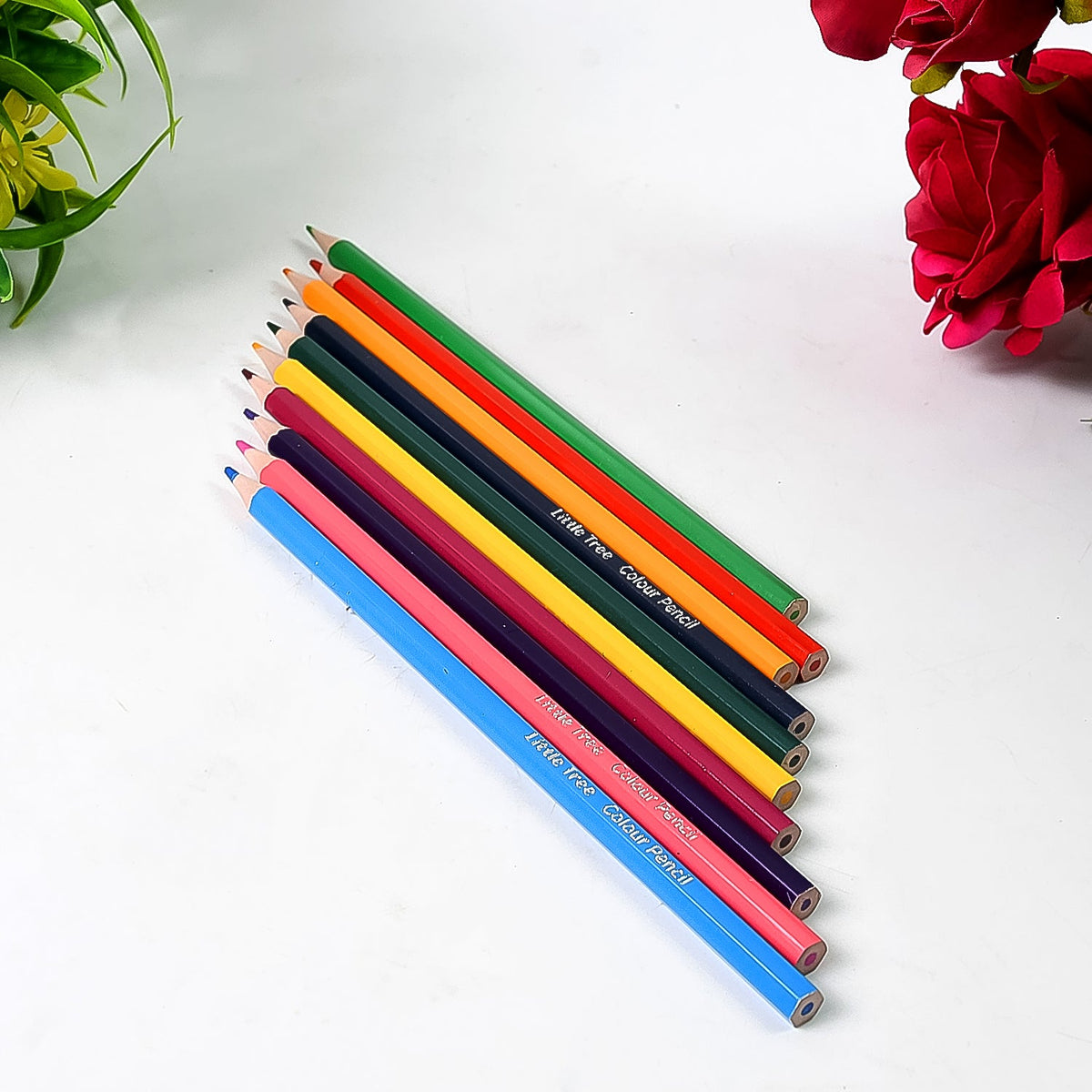 Hand holding a bright yellow colored pencil, ready for artistic creation.
