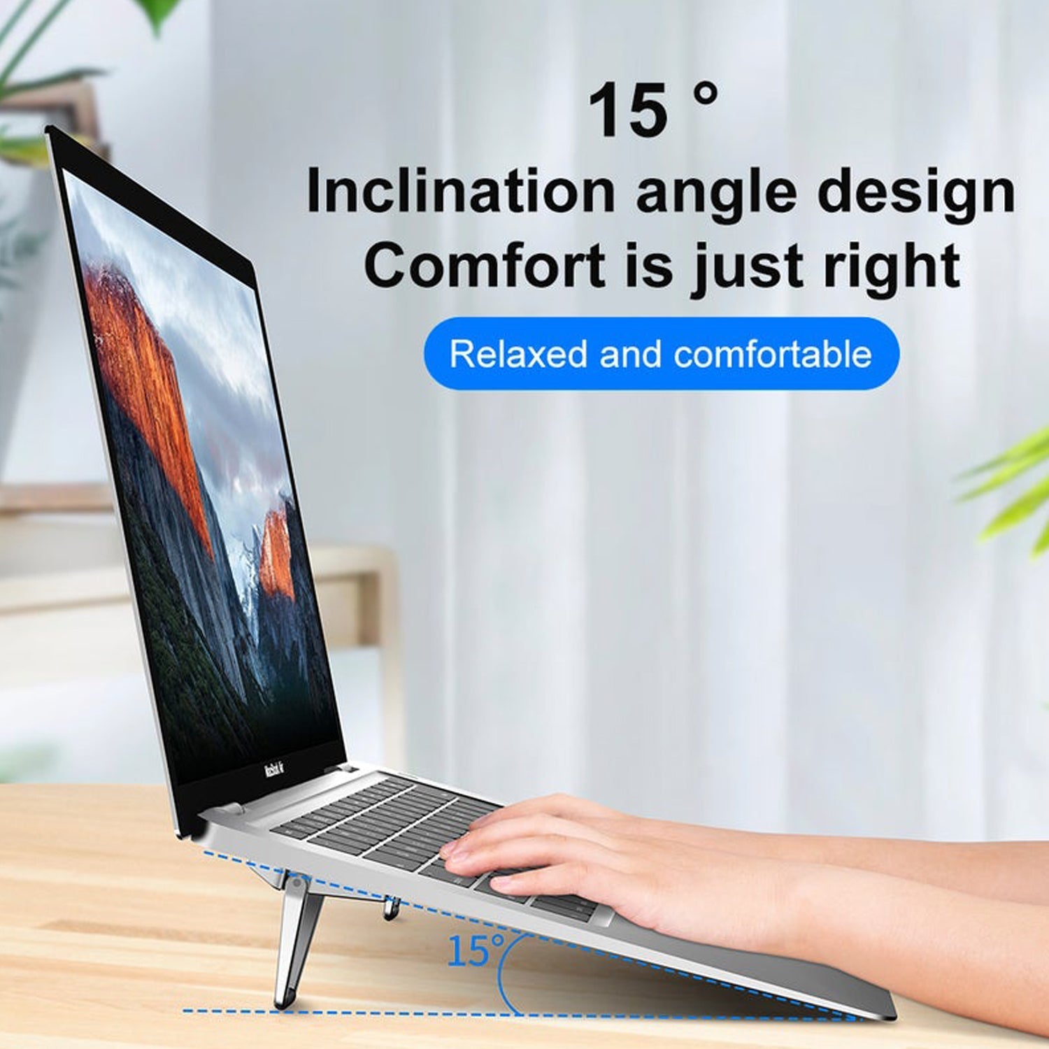 The mini metal folding laptop stand shown in its compact, folded state, ready for travel.