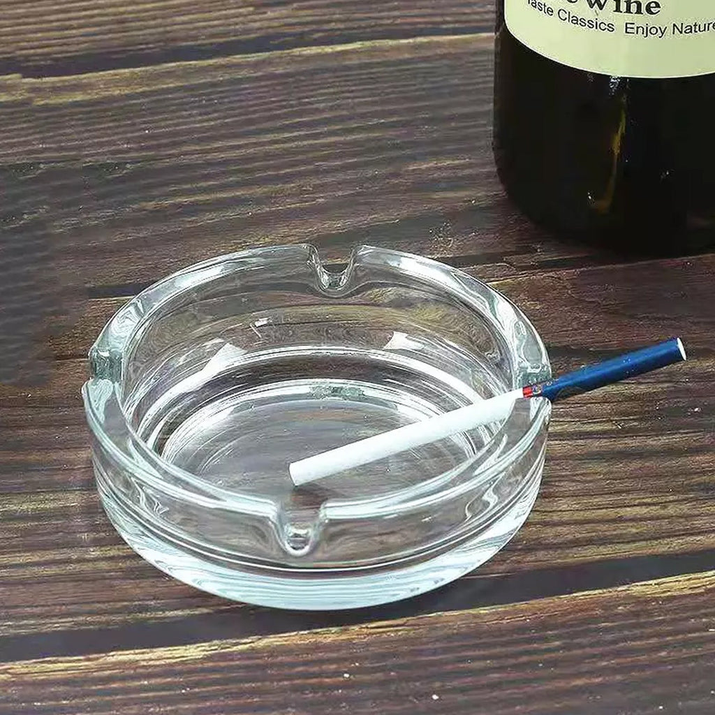 Elegant round crystal glass ashtray, perfect for modern home decor.