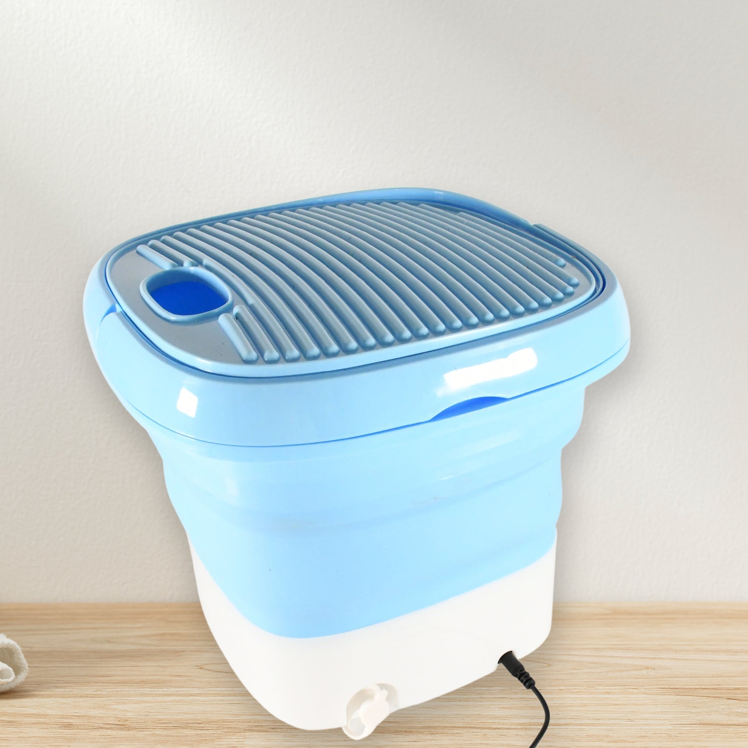 Detailed view of the portable washing machine's user-friendly control panel.