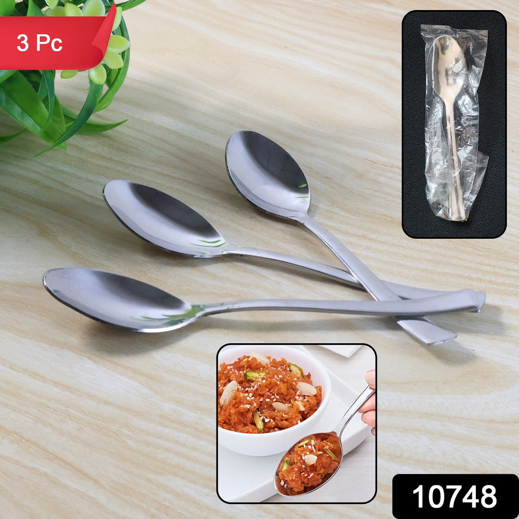 Dining spoons on a table setting showing ergonomic handles