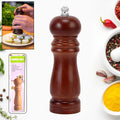 Elegant 6-inch wooden pepper mill with an adjustable ceramic grinder, ready for use.