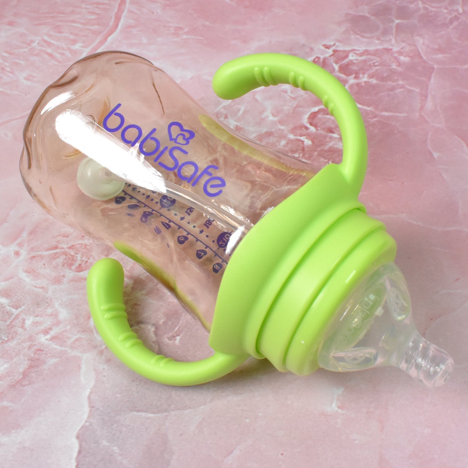Close-up of the silicone nipple and weighted straw inside the Plastic Baby Feeding Bottle.