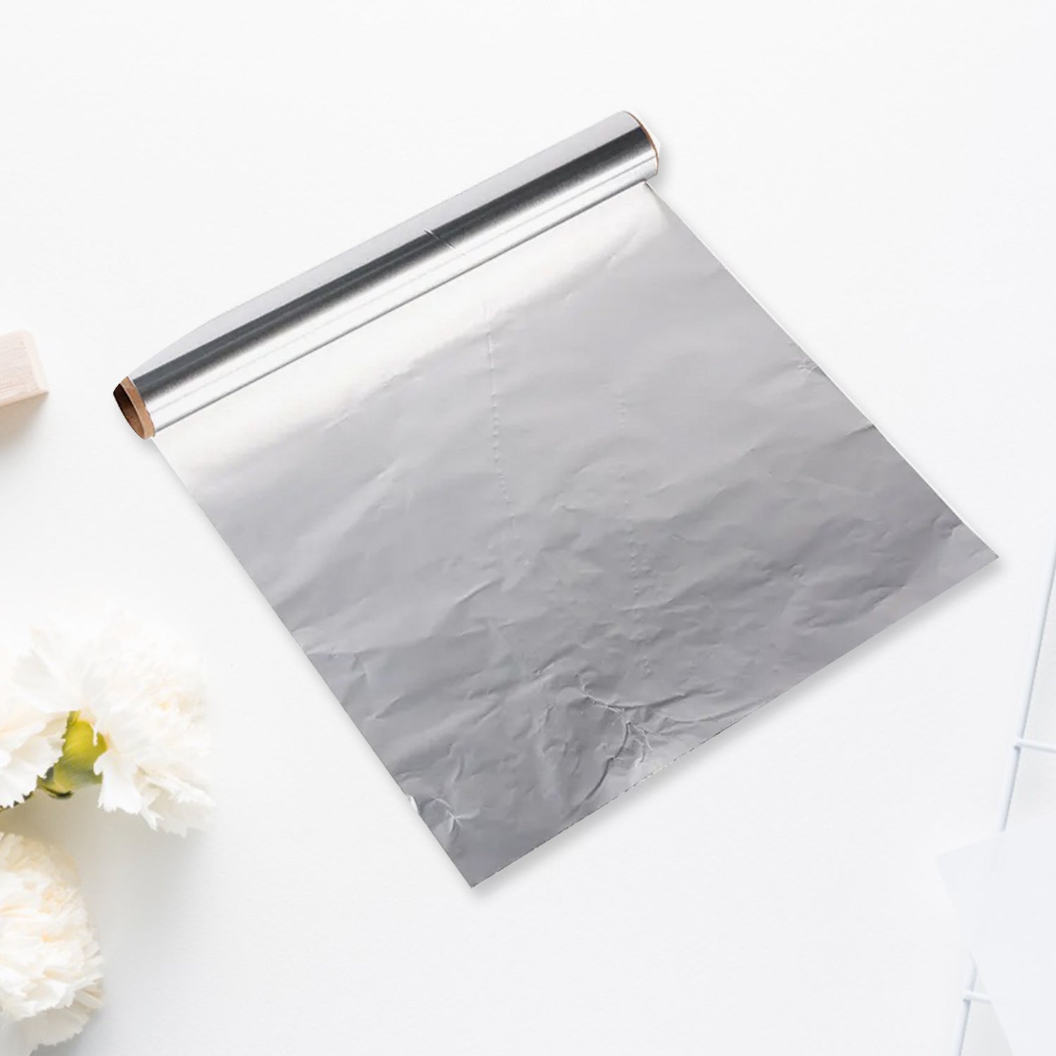 Thick aluminum foil roll, ideal for cooking and food storage.