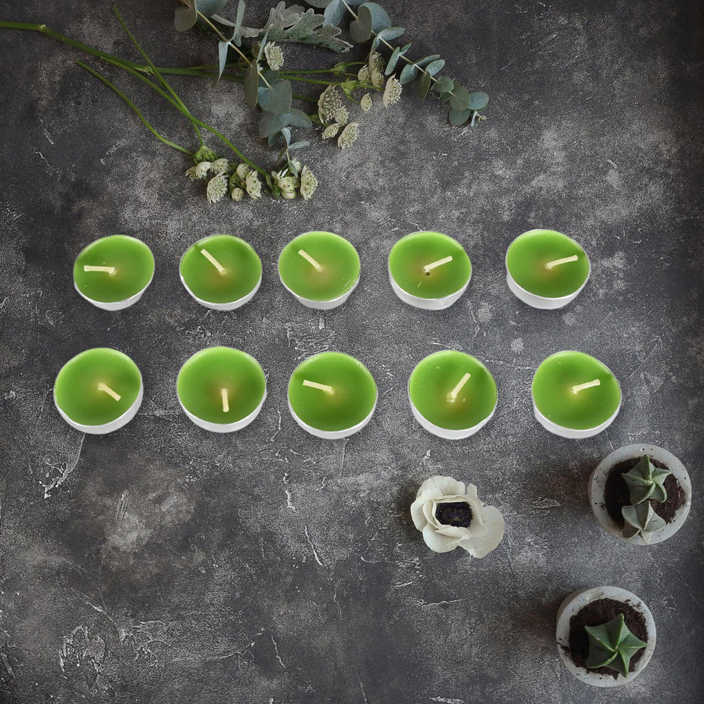 Diwali candles arranged artistically with traditional Indian diyas for home decoration.