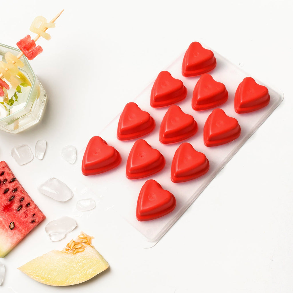 Colorful ice cubes with fruit designs ready to serve.