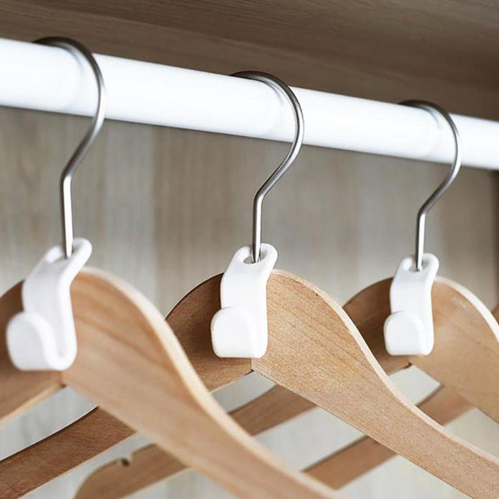 Multiple hanger connector hooks linking clothes hangers in a neat arrangement.