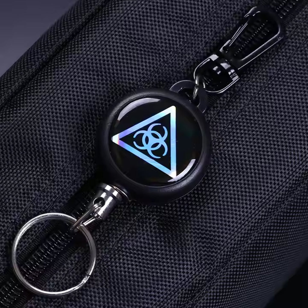 Retractor key chain with steel cable, showcasing its robust build quality.