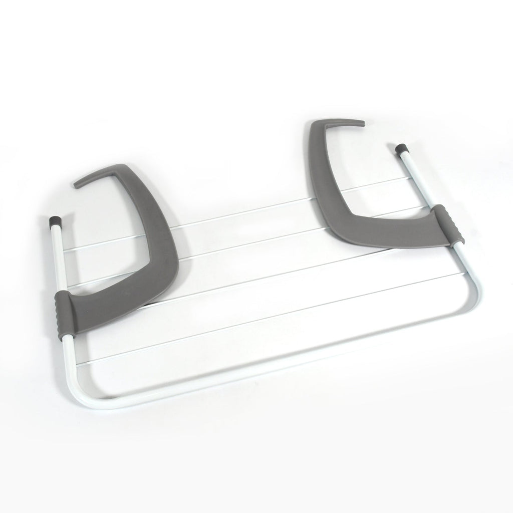 The versatile folding drying rack holding socks and towels, showcasing its multi-purpose design.