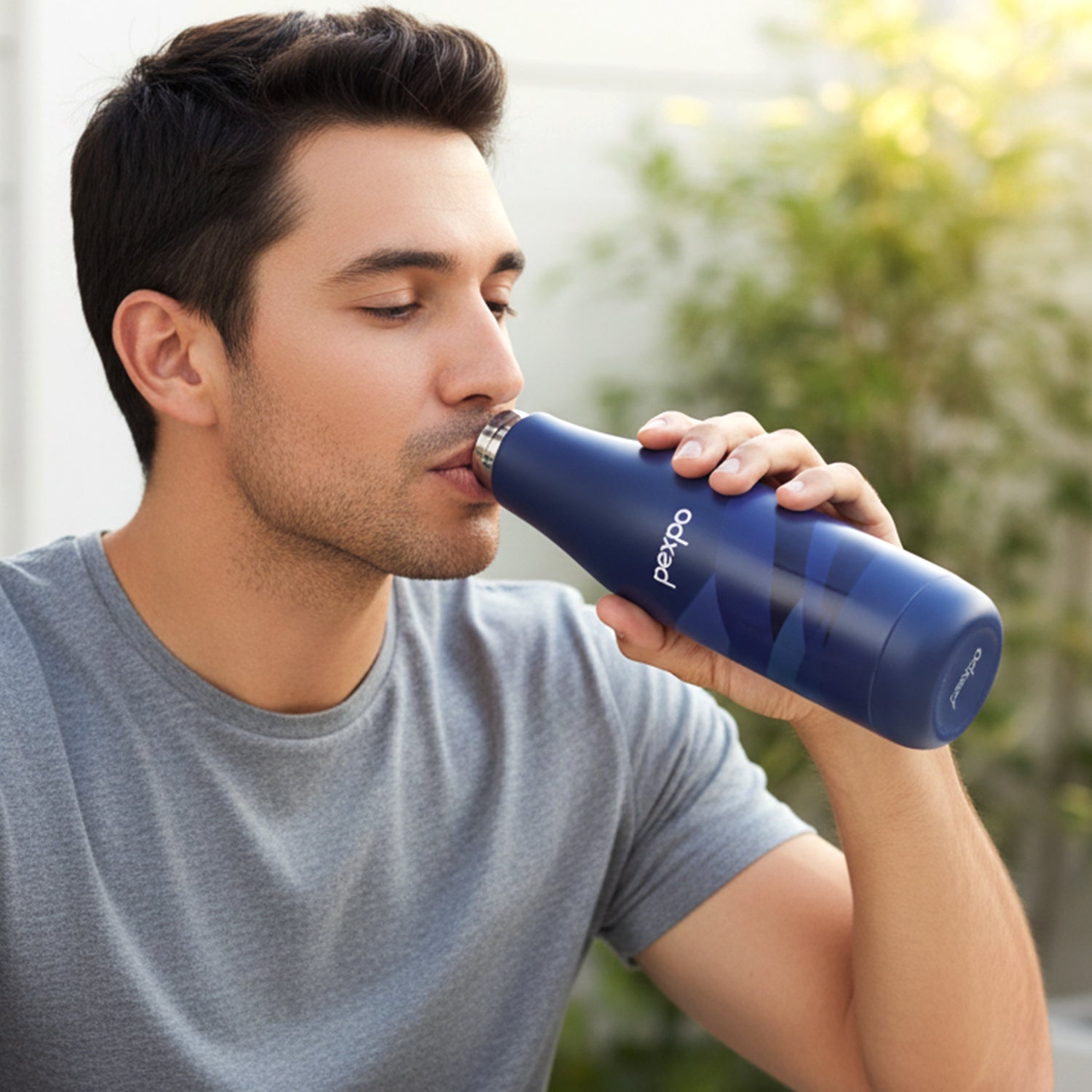 Side view of sleek stainless steel insulated water bottle