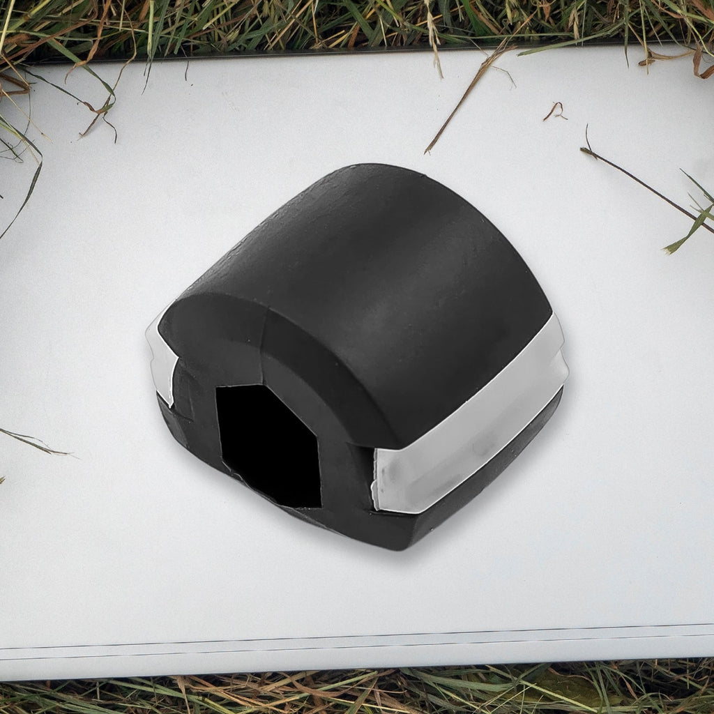 Side profile of the black Jaw Exerciser, showing its compact size.