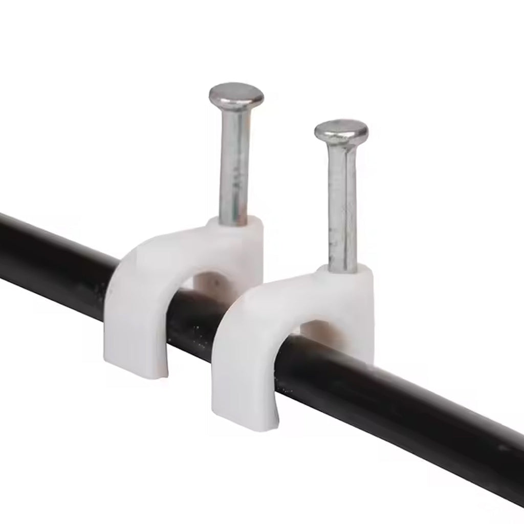 Close-up of plastic U-shaped 8mm nail cable clips with steel nails