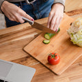 Large bamboo cutting board for kitchen prep, showcasing its smooth surface.