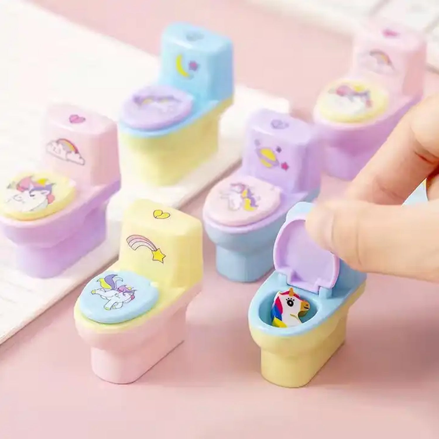 A pair of novelty toilet-shaped pencil sharpeners for school kids.