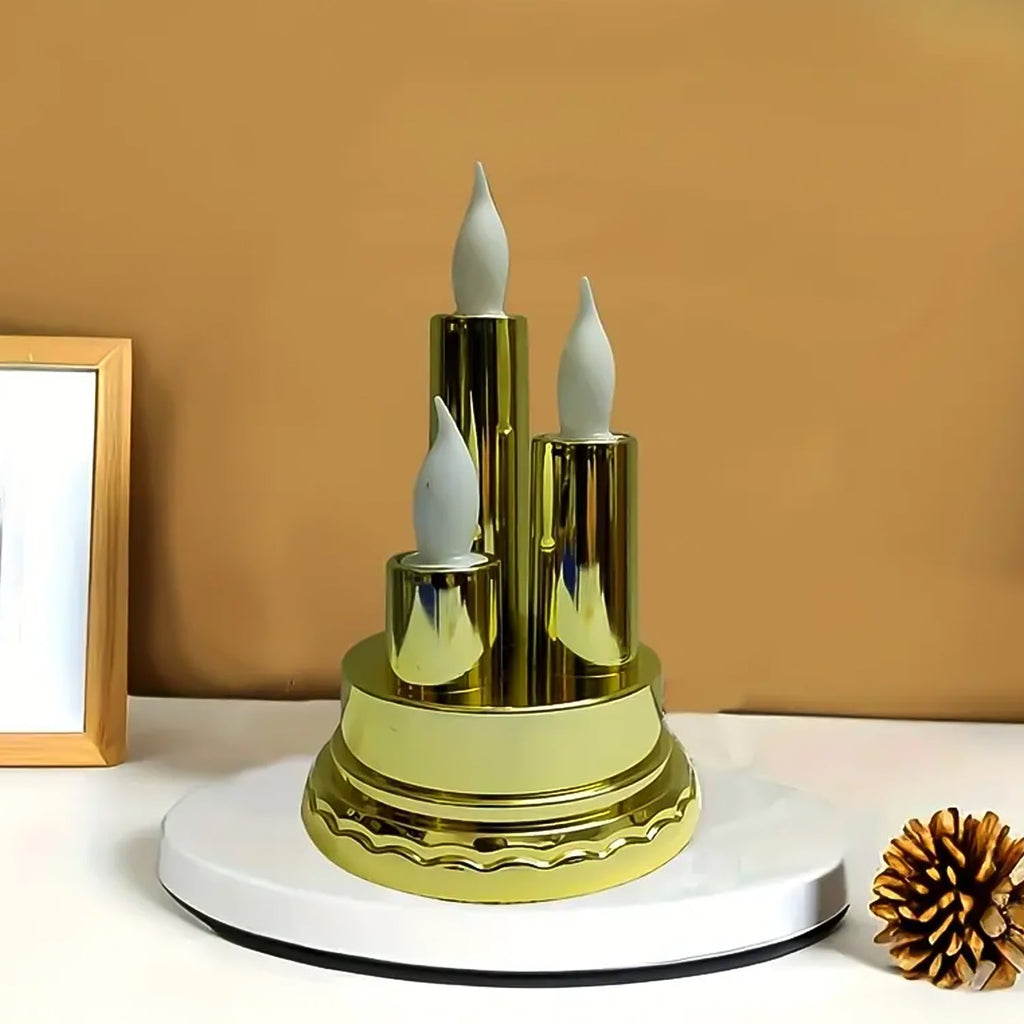 Close-up of golden LED flameless candle with flickering warm light