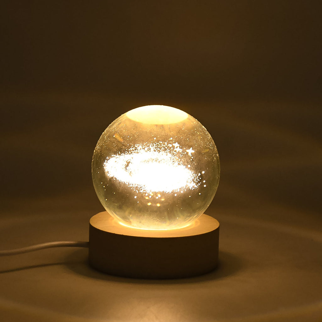 3D Crystal Ball Lamp emitting warm light on a desk, perfect as ambient lighting.