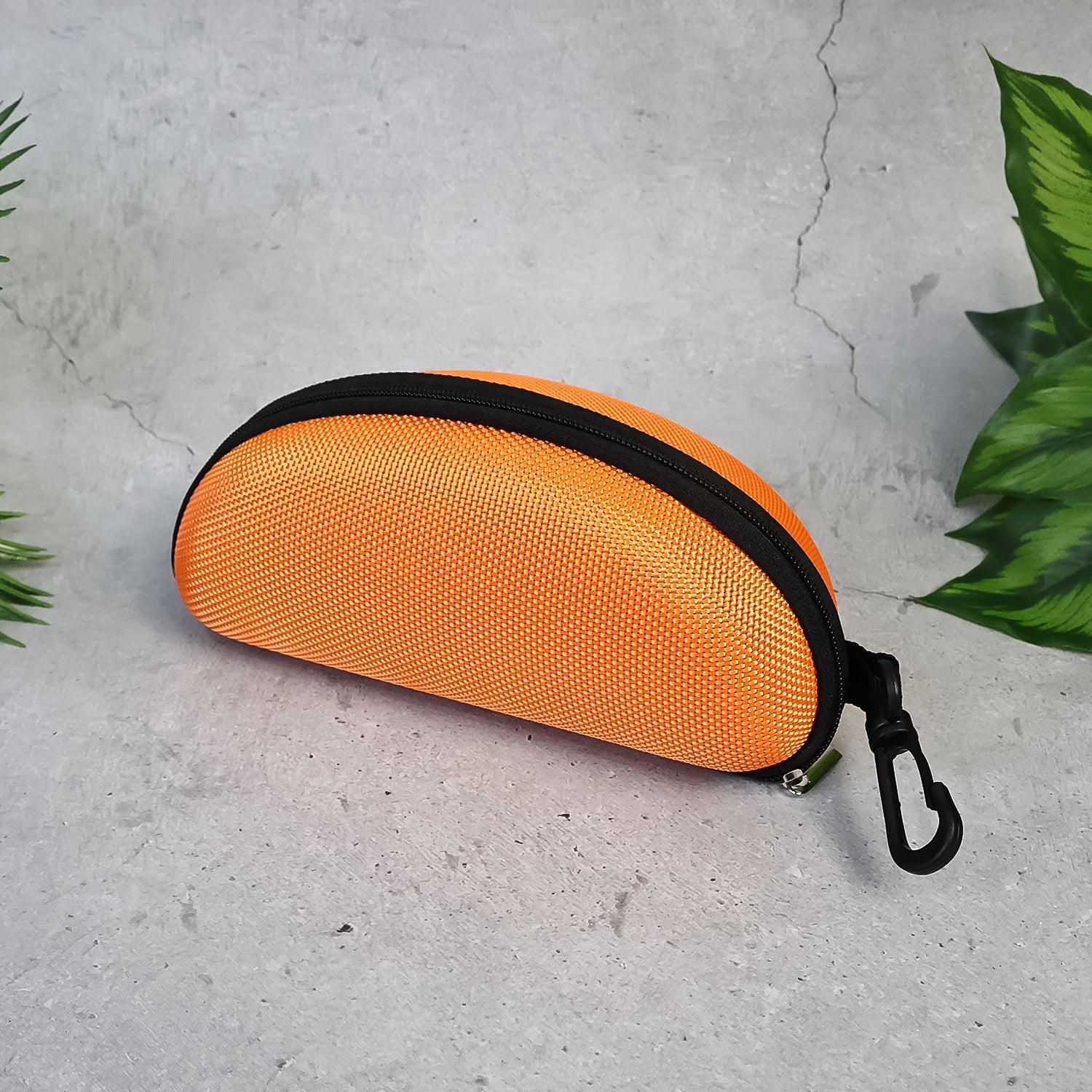 The zipper sunglasses case viewed from the top, showcasing its slim profile and secure closure.