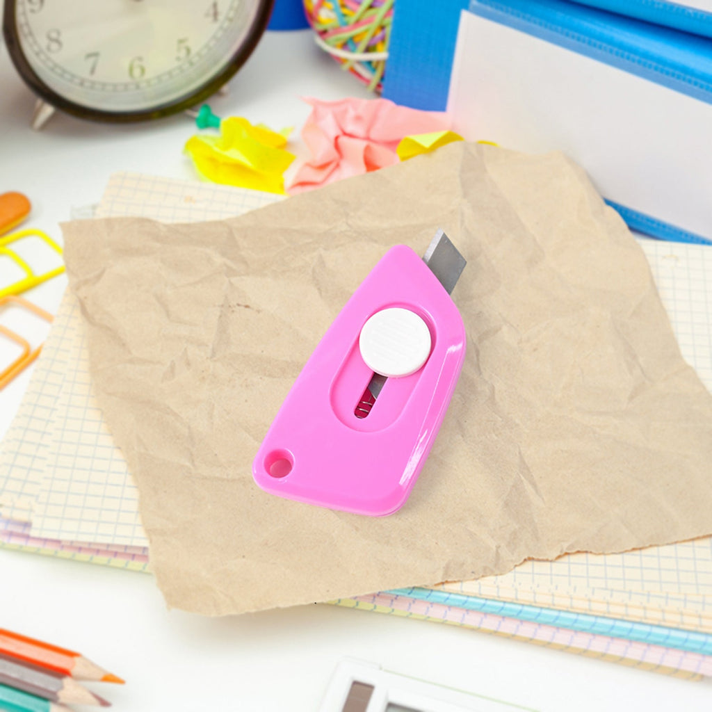 Mini Cloud Cutter utility knife being used to cut a plastic bag smoothly