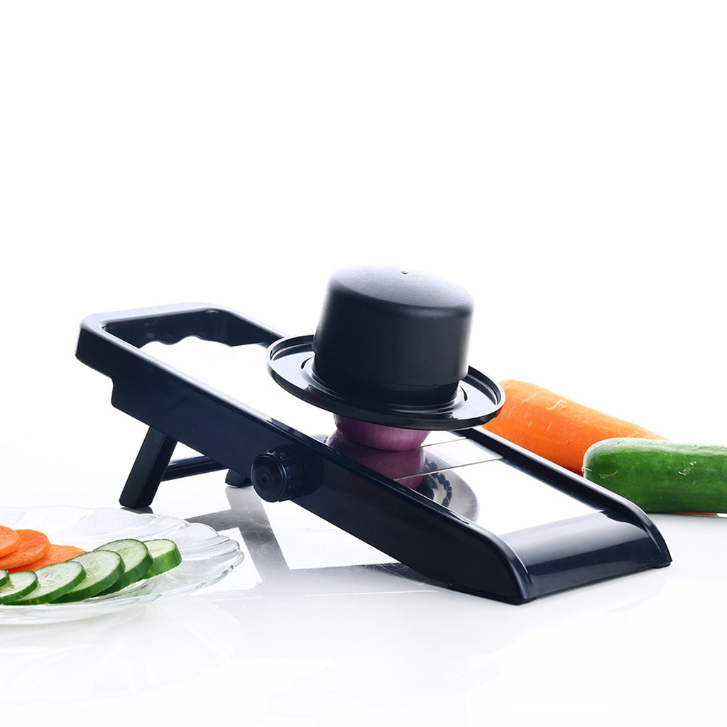 Multipurpose grater and slicer in action, preparing fresh vegetables for a meal.