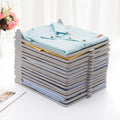 Compact plastic cloth organizer with folded garments, ideal for ironing shops.