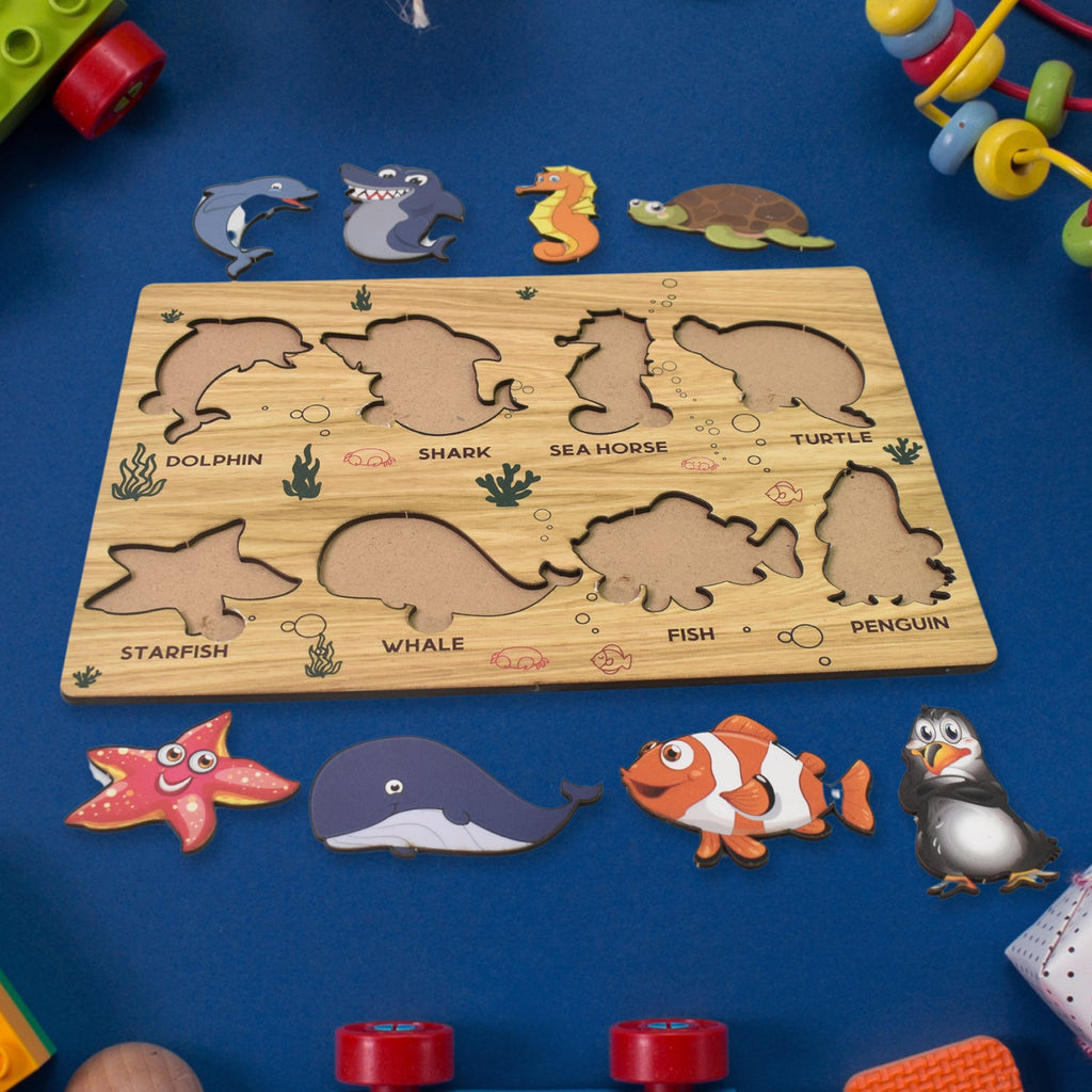 Detailed view of the smooth, child-safe wooden pieces of the sea animal puzzle.
